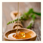 Yate honey being drizzled onto a wooden spoon - Rich, pure Australian yate honey from Bee Greedy